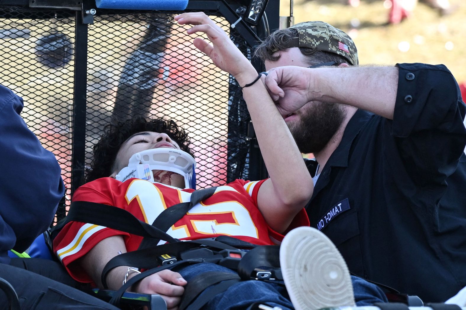A Kansas City Chiefs fan receives medical treatment after a shooting that occurred right after the team's Super Bowl celebrations on Wednesday, February 14.