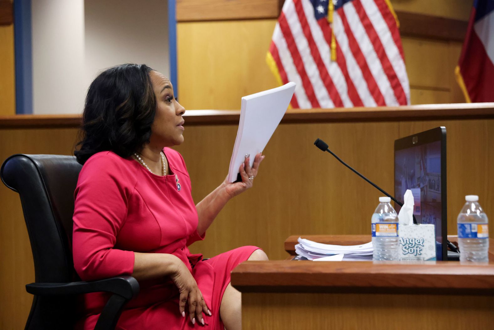 Fulton County District Attorney Fani Willis testifies during a hearing in Atlanta on Thursday, February 15. A judge is considering whether Willis, who brought an election subversion case against former President Donald Trump and 18 other co-defendants, should be disqualified based on allegations that she and Nathan Wade, the special prosecutor she hired to lead the case, engaged in an improper romantic relationship that financially benefited her. Wade and Willis have acknowledged that they had a personal relationship but deny any wrongdoing.