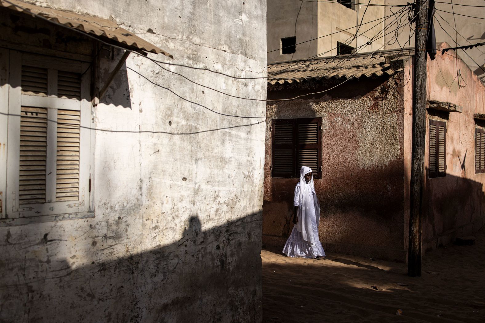 A woman walks down a road in Dakar, Senegal, on Sunday, February 11. See last week in 32 photos.