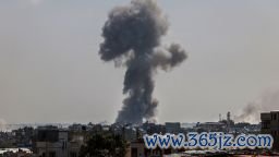 TOPSHOT - A billow of smoke rises following Israeli bombardment in Nuseirat, central Gaza, on April 12, 2024, amid ongoing battles between Israel and the Palestinian militant group Hamas. (Photo by AFP) (Photo by -/AFP via Getty Images)